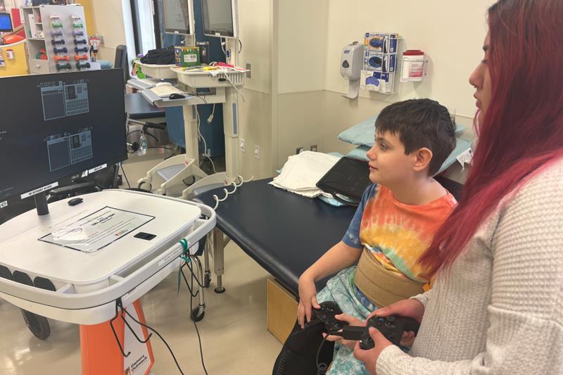 Young patient at Nemours Children’s Hospital playing a game